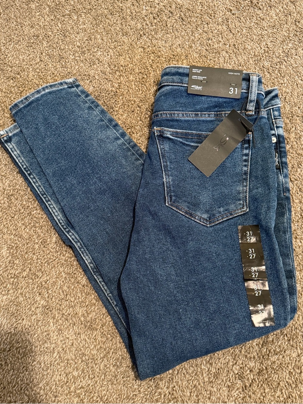 Silver high note skinny jeans.